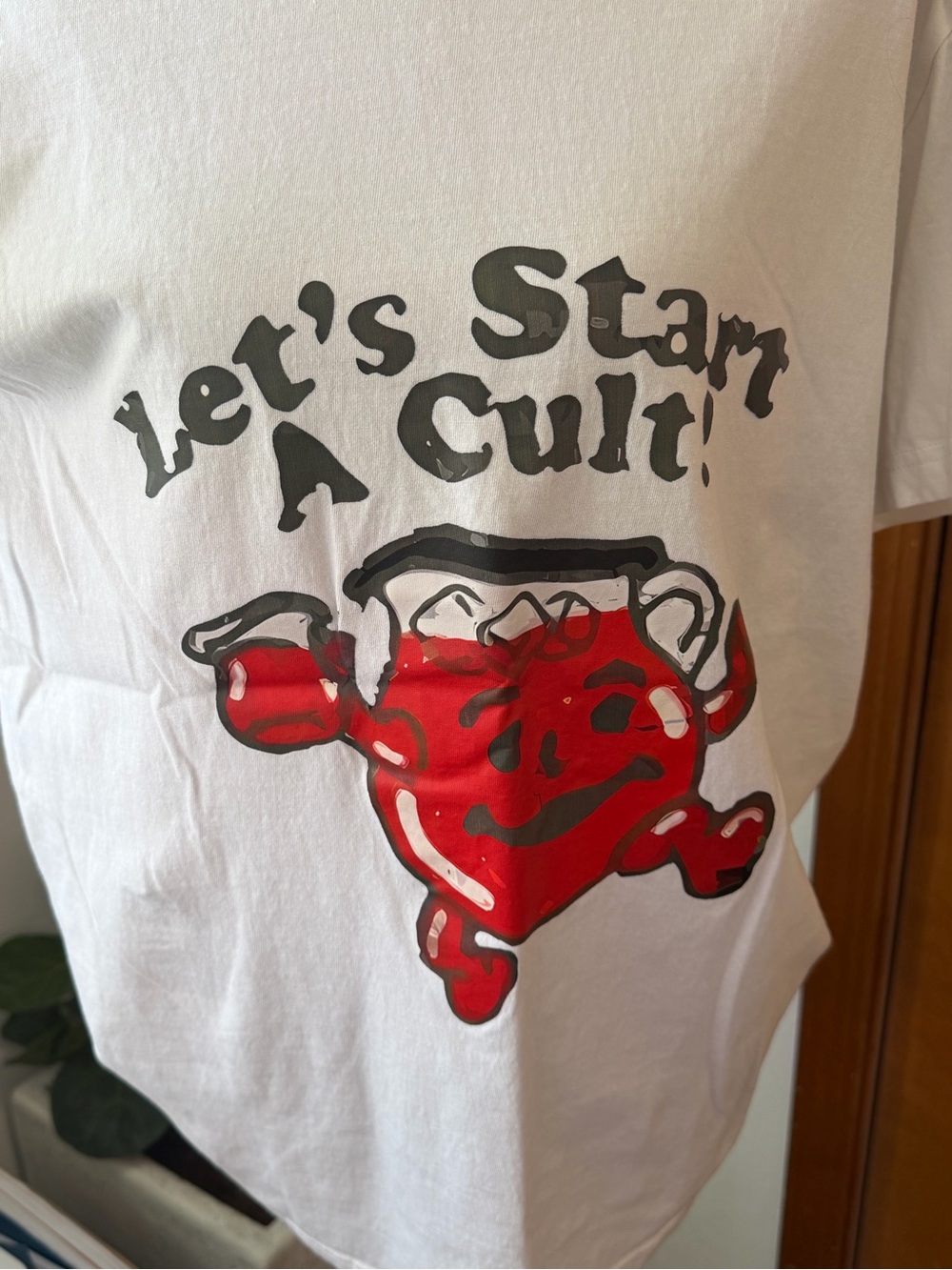 White Short-Sleeve Graphic Tee with Red Character Print - Let's Start A Cult